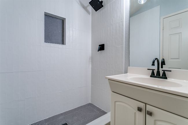 Full bathroom with vanity and a tile shower | Image 15
