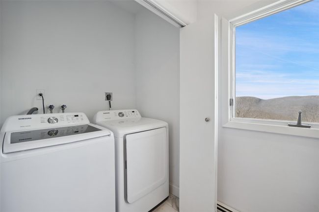 Laundry area with laundry area and separate washer and dryer | Image 25
