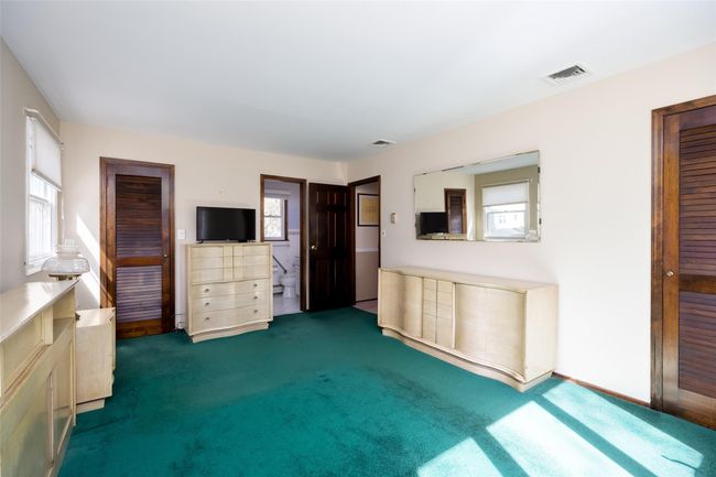 Unfurnished living room featuring visible vents and carpet | Image 27