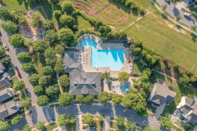 Aerial photo of the community center, main pool, kiddie pool and playground. This space is about 4 houses up the street on the right | Image 29