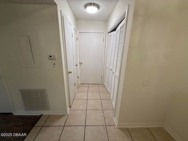 hall to bathroom / laundry in closet | Image 35