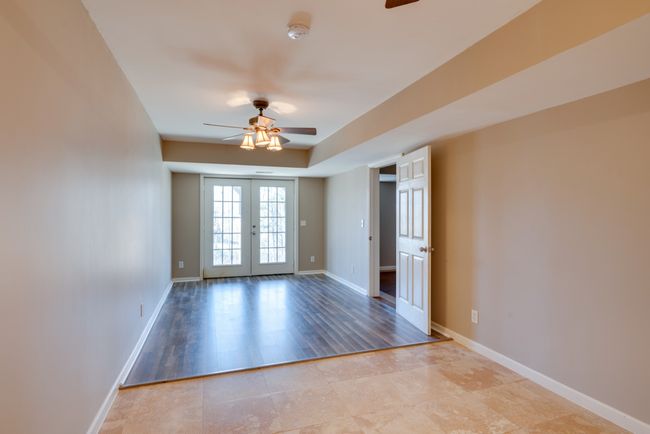 Double doors lead to a personal patio and spacious backyard. | Image 37