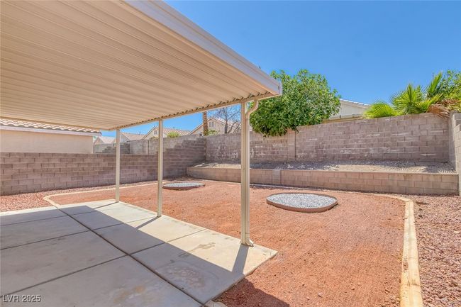 Fenced backyard featuring a patio area | Image 28