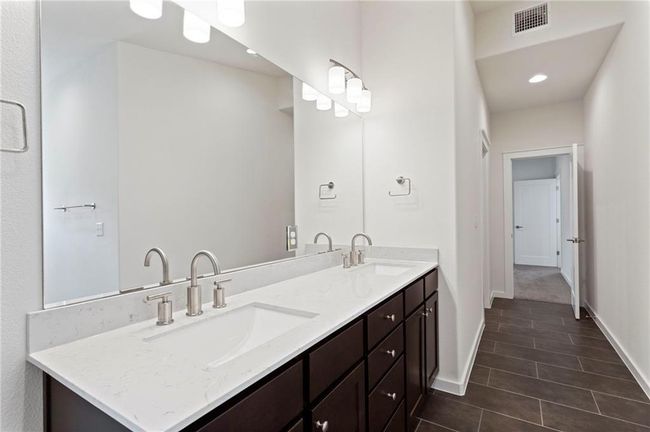 Bathroom featuring double vanity, tile patterned flooring, and recessed lighting | Image 20