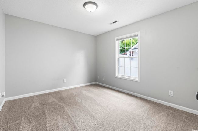 Carpeted empty room with baseboards | Image 16