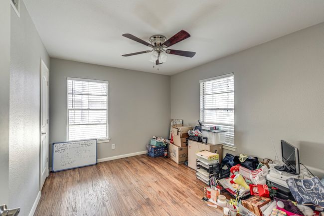 Office featuring baseboards, ceiling fan, and wood finished floors | Image 4