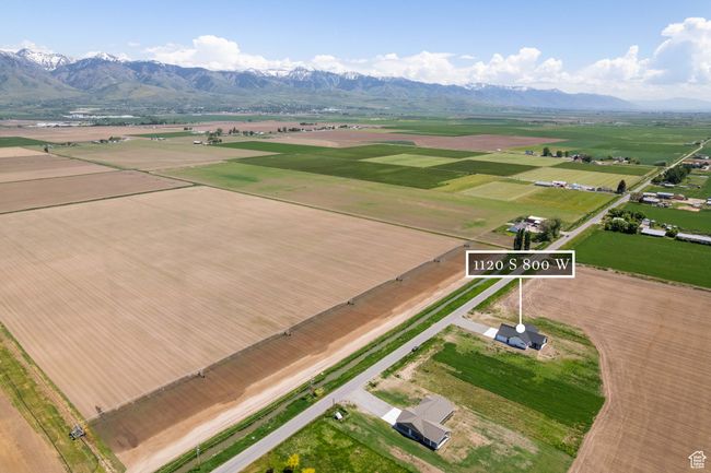 Aerial view of sparsely populated area featuring a mountainous background | Image 21