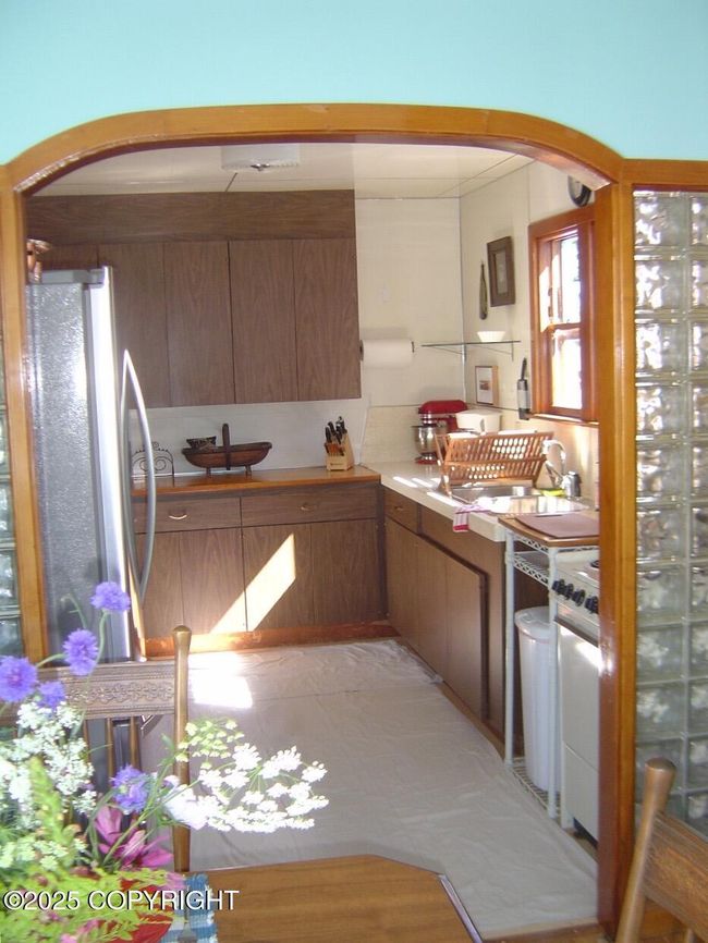 Front Unit Arched Doorway to Kitchen | Image 17