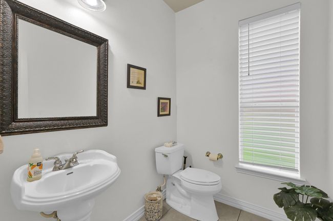 Downstairs powder bath is situated between the two offices. | Image 35