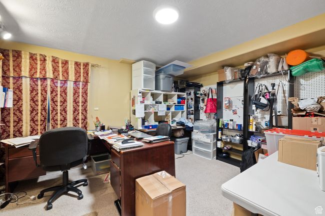 Carpeted office space with a textured ceiling | Image 35