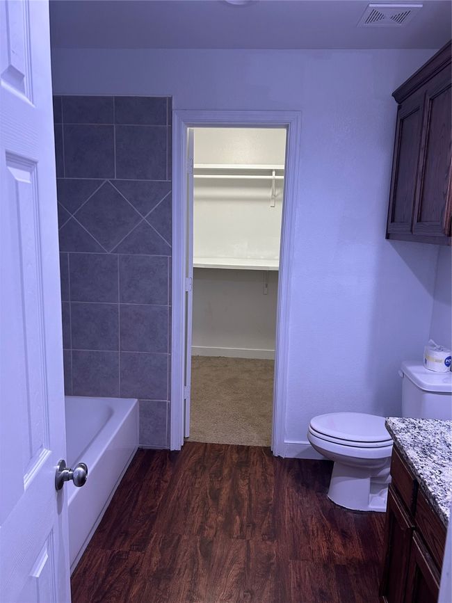 Bathroom with wood finished floors and vanity | Image 16