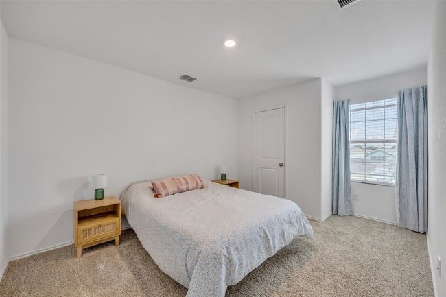 Bedroom featuring light carpet and recessed lighting | Image 22