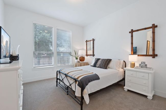 Carpeted bedroom with baseboards | Image 30