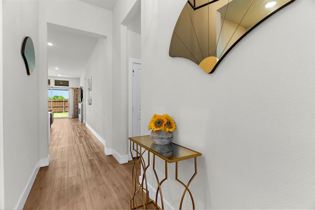 Hallway with light wood-type flooring, baseboards, and recessed lighting | Image 7