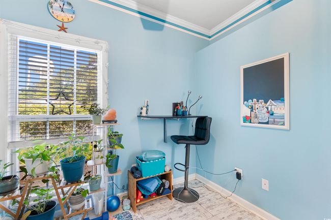 Misc room featuring ornamental molding and baseboards | Image 11