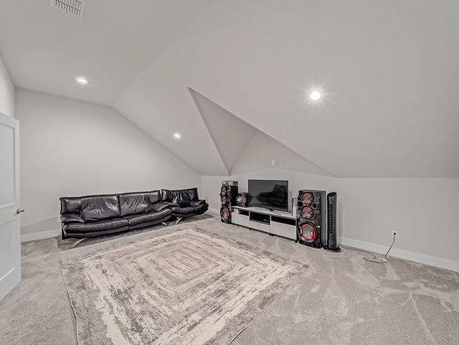 Carpeted living room with vaulted ceiling, recessed lighting, and baseboards | Image 25