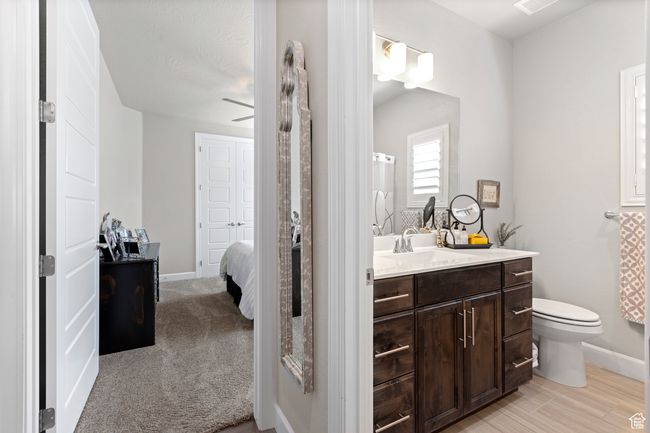 Bathroom featuring vanity, connected bathroom, and ceiling fan | Image 26