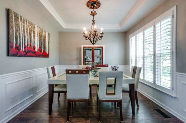 Formal dining with abundant natural light and plantation shutters | Image 8