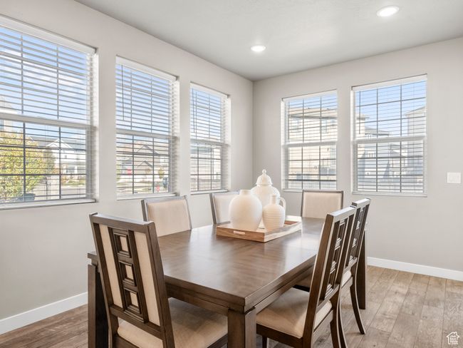 Dining area featuring light wood-style floors, plenty of natural light, and recessed lighting | Image 14