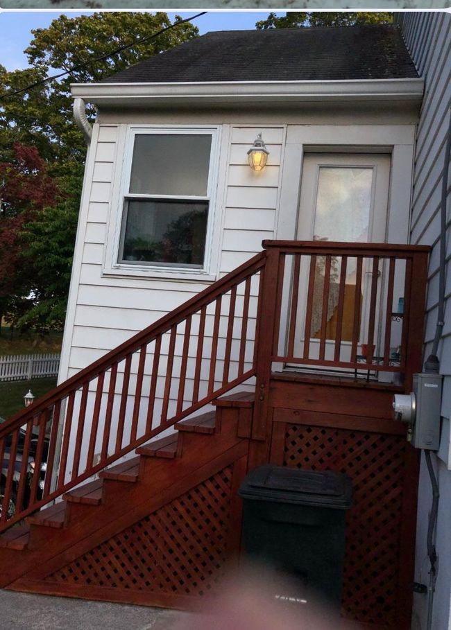 Property entrance featuring a shingled roof | Image 47