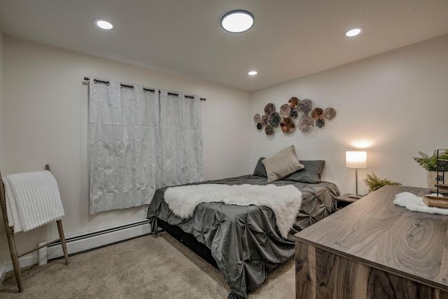 Bedroom featuring recessed lighting, carpet flooring, and baseboard heating | Image 21