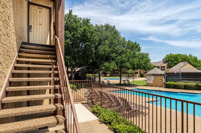 Pool featuring entry steps and fence | Image 18