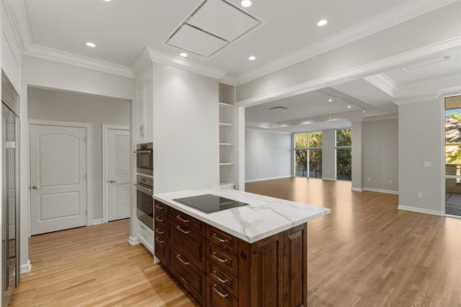 Kitchen open to the dining and living room. | Image 13