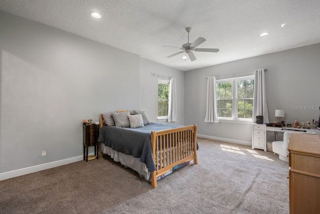 Bedroom #5, only room on the second story, with walk-in closet and private bathroom...perfect for a guest suite or bonus room. | Image 35