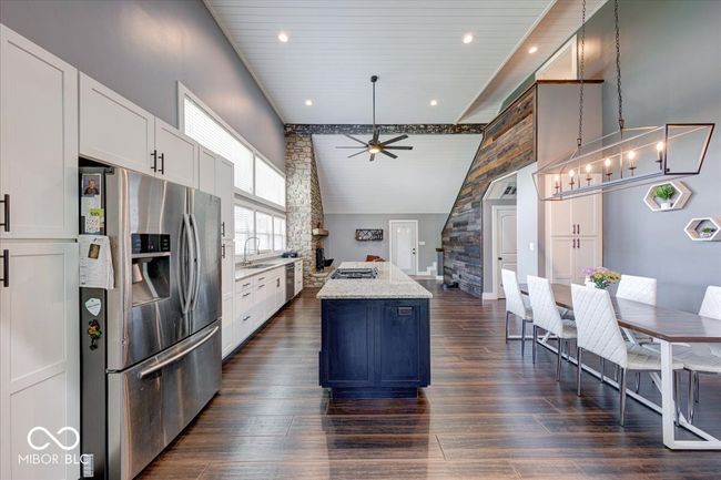 beautiful open kitchen with great cabinet and counter space and an eat-in dining space | Image 19