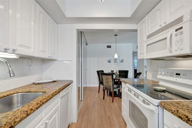 Beautiful granite countertops and plenty of kitchen cabinets | Image 20