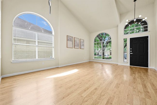 Foyer featuring high vaulted ceiling and wood finished floors | Image 8