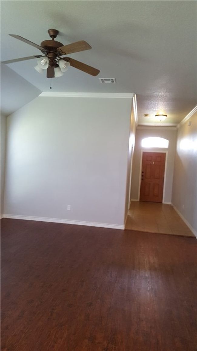 Spare room with a ceiling fan, light wood-type flooring, and ornamental molding | Image 4