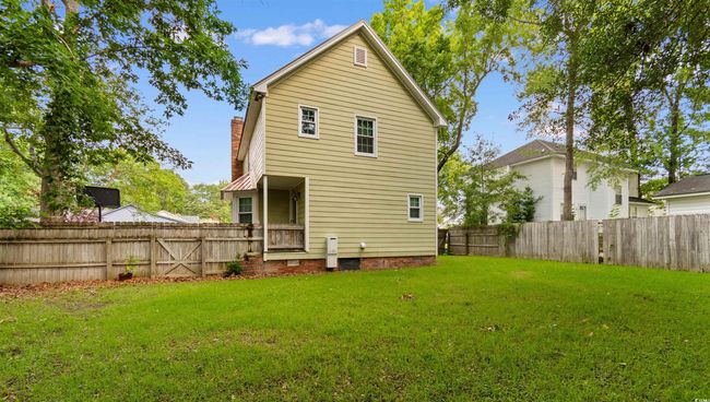 Back of house with a fenced backyard and a chimney | Image 32