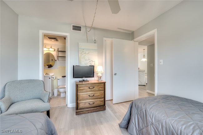 Bedroom featuring connected bathroom and light hardwood / wood-style floors | Image 30
