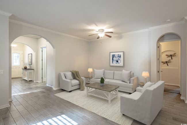 Virtually staged example of living area with possible option for furniture placement. | Image 16