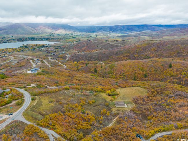 Bird's eye view with a water and mountain view | Image 16