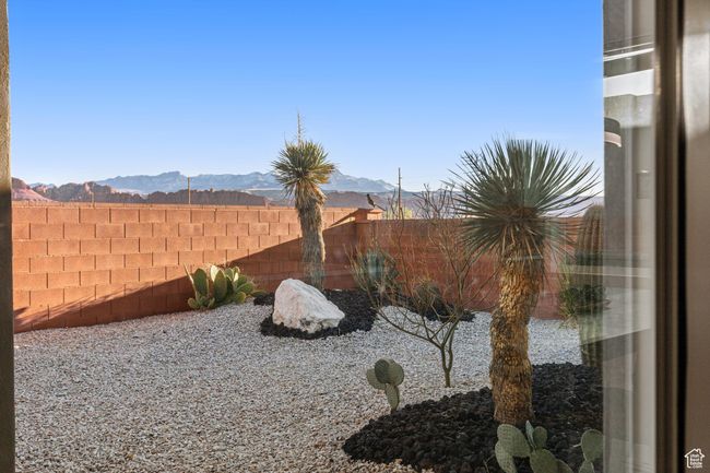 View of yard featuring a mountain view and fence | Image 30