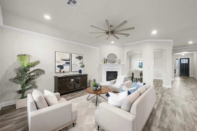 The neutral color palette and rich hardwood flooring provide a timeless and sophisticated aesthetic. | Image 8