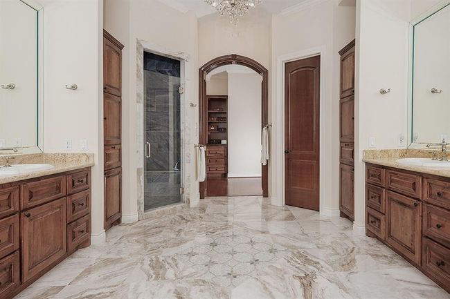 Large shower and an enormous walk-in closet with built-ins | Image 22