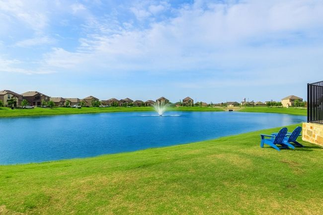 Water view with nearby suburban area | Image 39