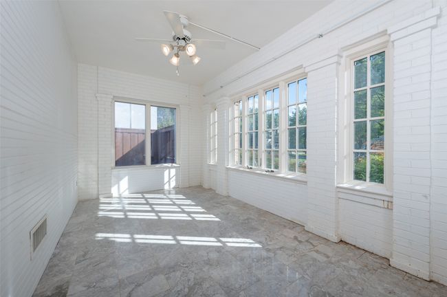View of unfurnished sunroom | Image 18