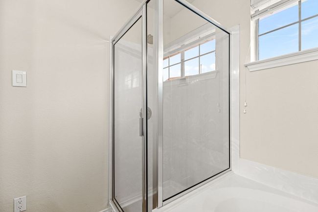 Bathroom with a bath and a stall shower | Image 21