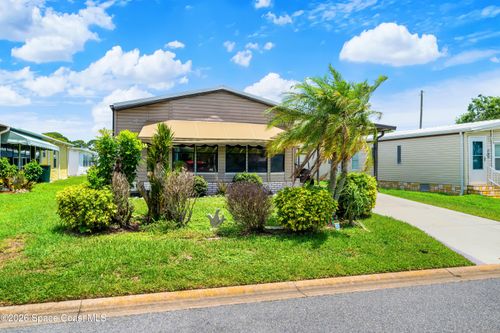 602 Dolphin Cir, Barefoot Bay, FL, 32976-2598 | Card Image