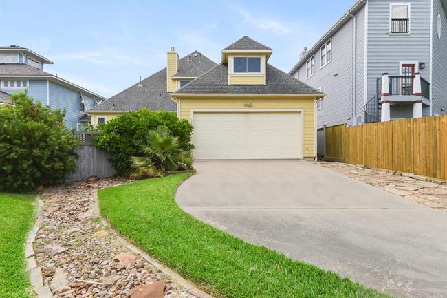 Convenient rear entrance with additional parking space. | Image 42