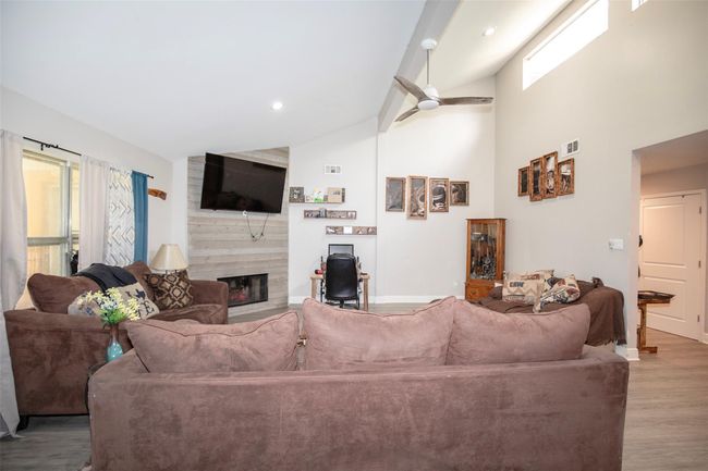 Living room with tall ceilings | Image 8