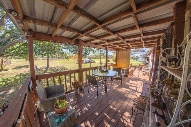 Wooden deck with a lawn | Image 21
