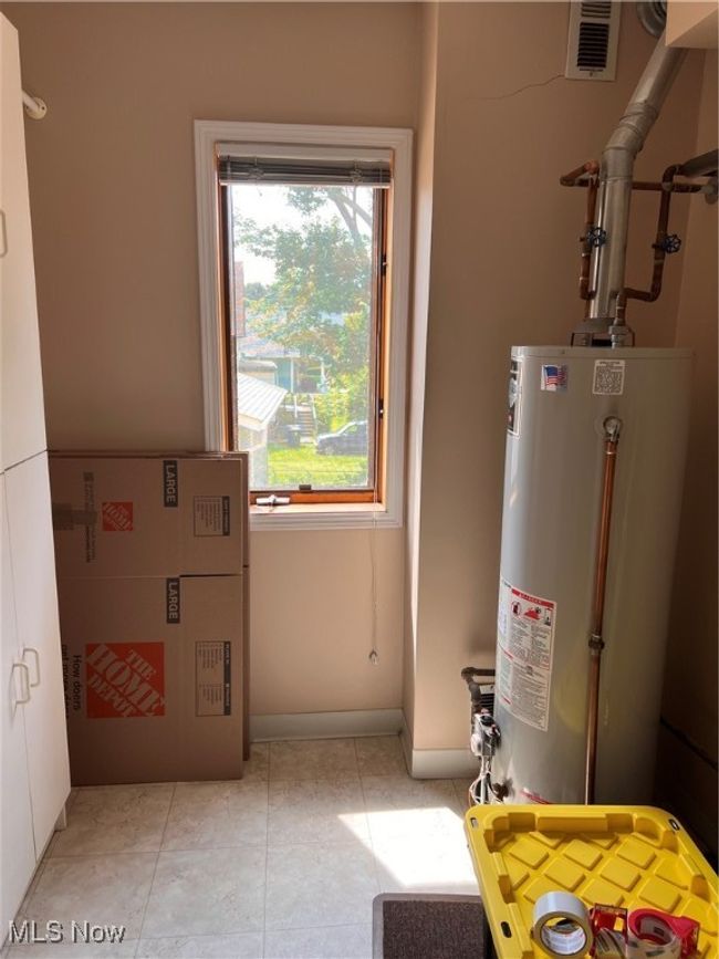 Utility room featuring water heater | Image 16