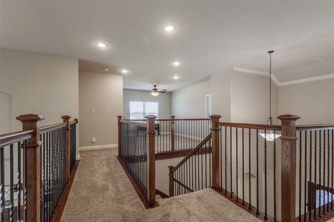 Corridor featuring dark colored carpet | Image 26
