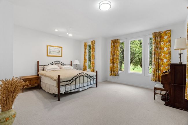 Warm and inviting lower-level primary bedroom. | Image 18