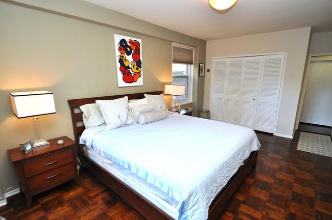 Large Bedroom can accommodate a king size bed, dresser, end tables and reading chair. The room also has parquet floors. | Image 17